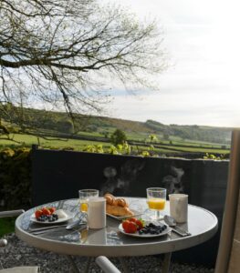 Dining outdoors at the Merlin Shepherds Hut in Derbyshire