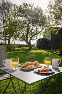 Enjoying breakfast outside the Pheasant Shepherds Hut