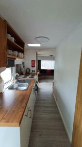 Kitchen leading to living area in Static Caravan