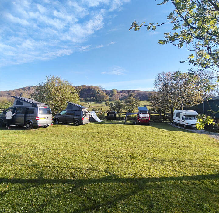 Campers and a tent at Derbyshire Hills Campsite